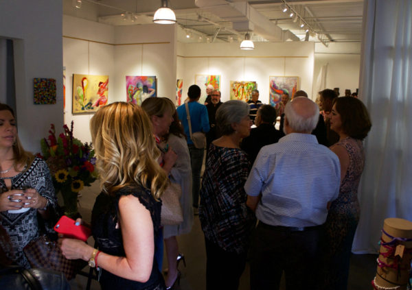 Attendees at the opening reception of Peraldi's and Marino's dual exhibition.